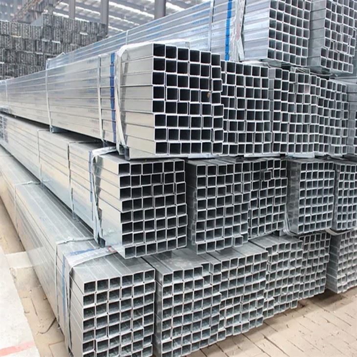 Galvanized square tube bundles in the yard with visible bundle tags and strapped packing