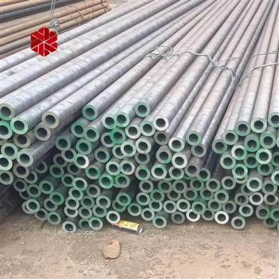 workshop with stacked seamless steel pipe ready for inspection